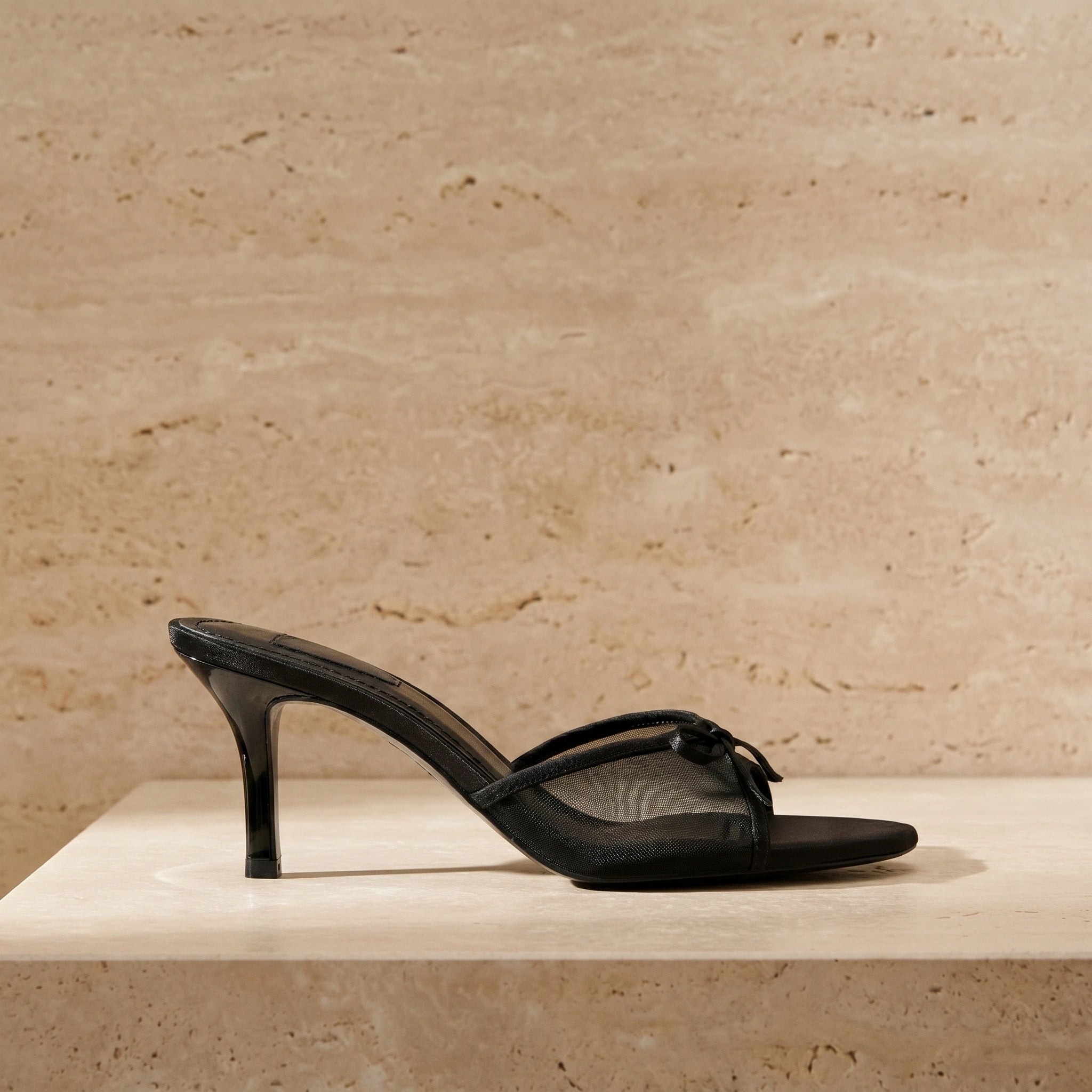 Back view of a model wearing women's peep toe summer heels, showing the design and construction details against a neutral background.