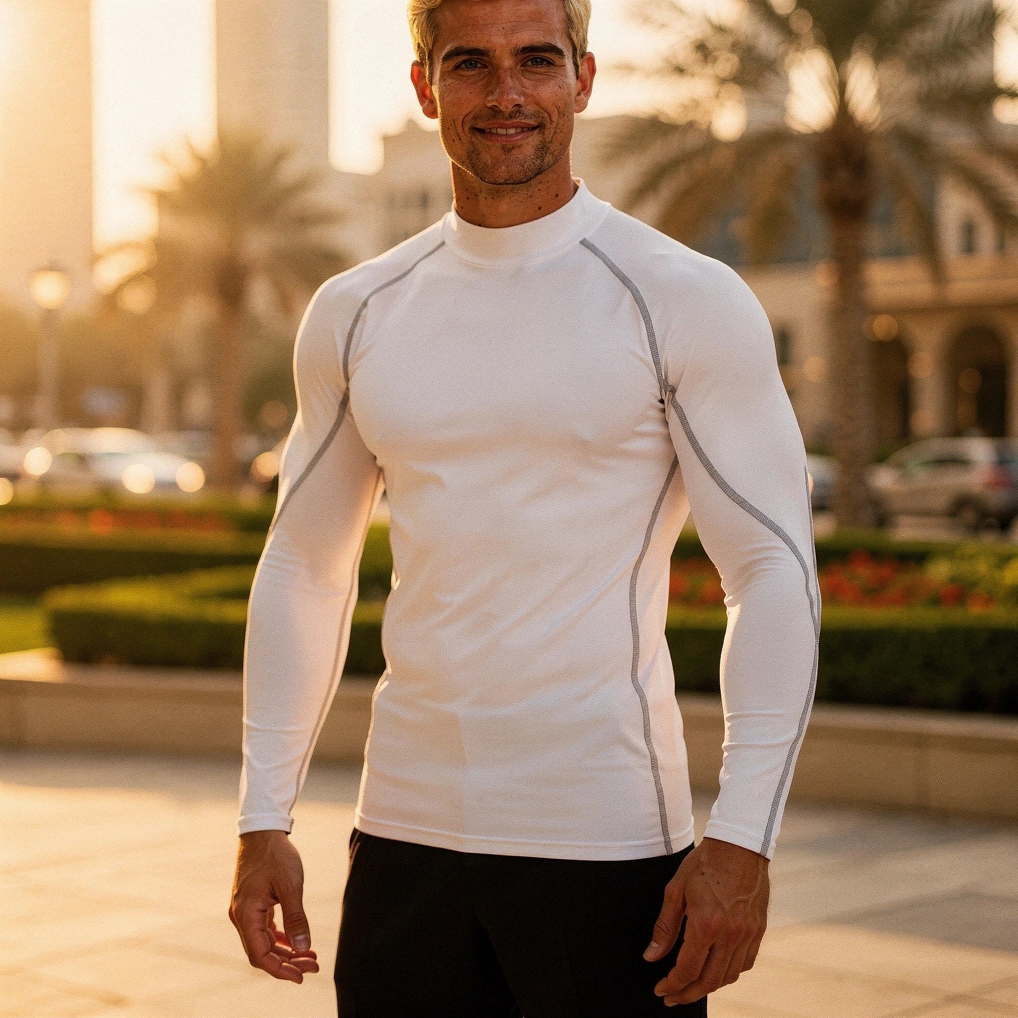 View of a black fleece backed compression winter tee, featuring a fitted design and long sleeves