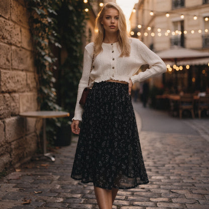 Light pink midi skirt with a flowy silhouette, featuring a delicate floral pattern and a soft, lightweight fabric, view