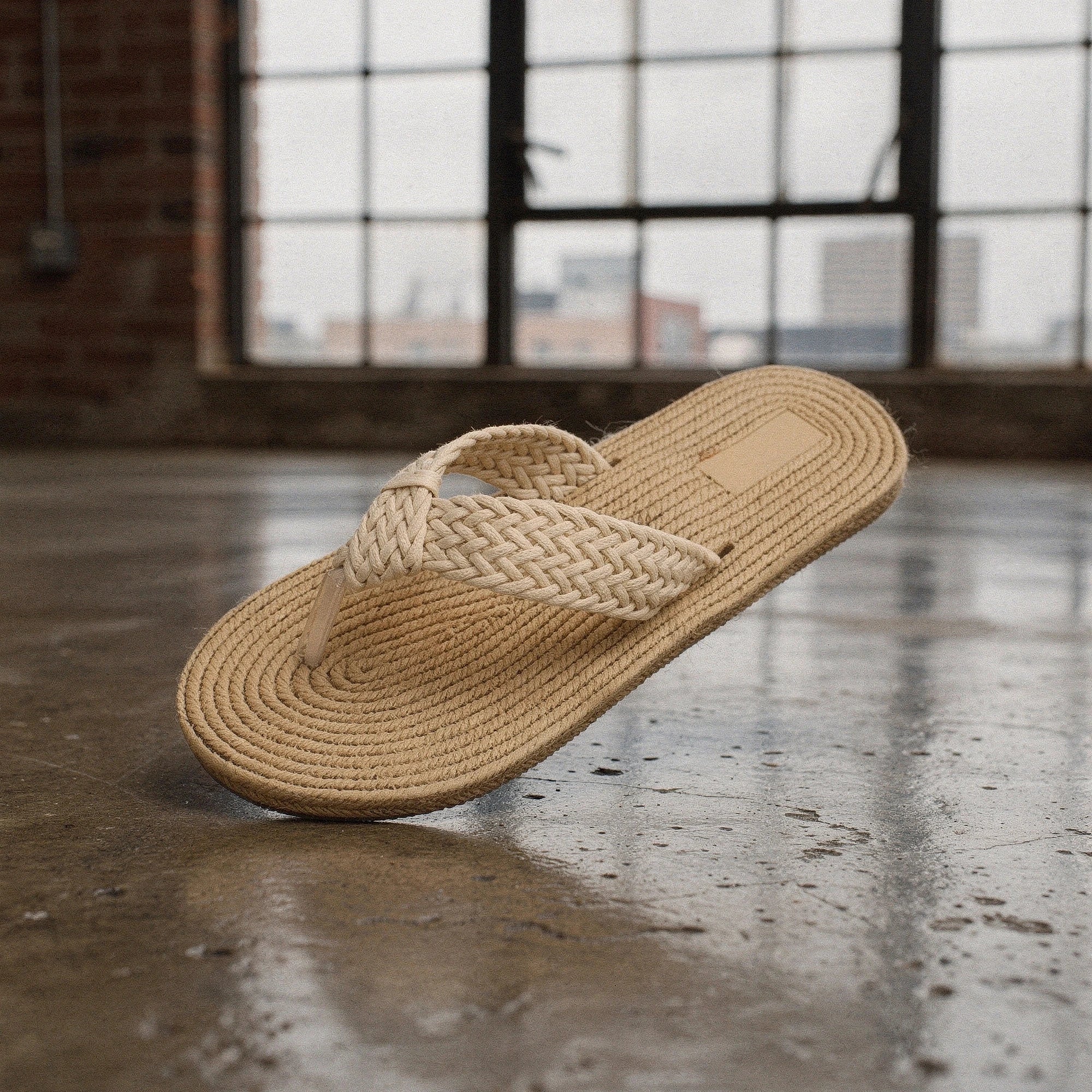 View of relaxed textured imitation hemp flip flops in natural beige color, showcasing the soft material and comfortable straps