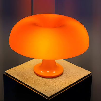 View of a contemporary sculpted acrylic mushroom table lamp in clear and frosted finishes, showcasing its unique shape and design