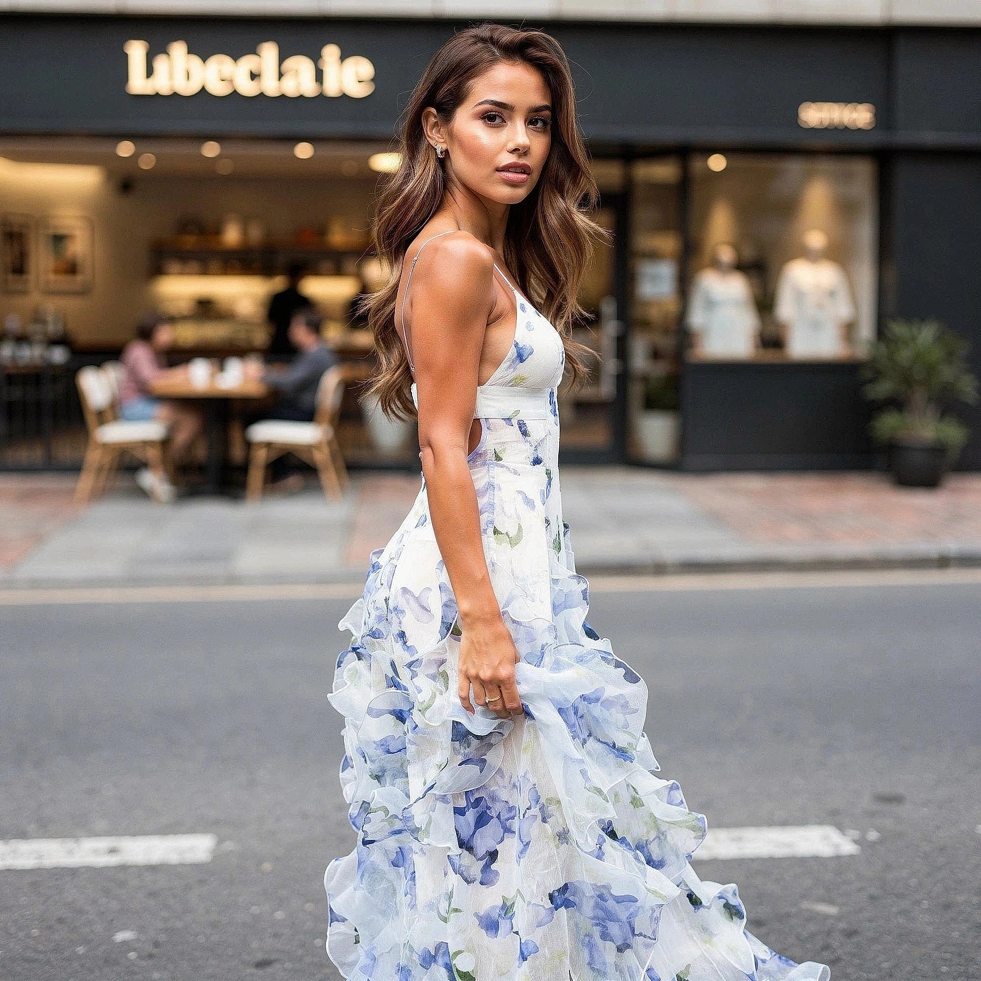 View of a flowy maxi dress featuring elegant cut out details, made