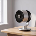 A modern cordless desk fan with a streamlined design, featuring adjustable airflow and a user friendly control panel on the