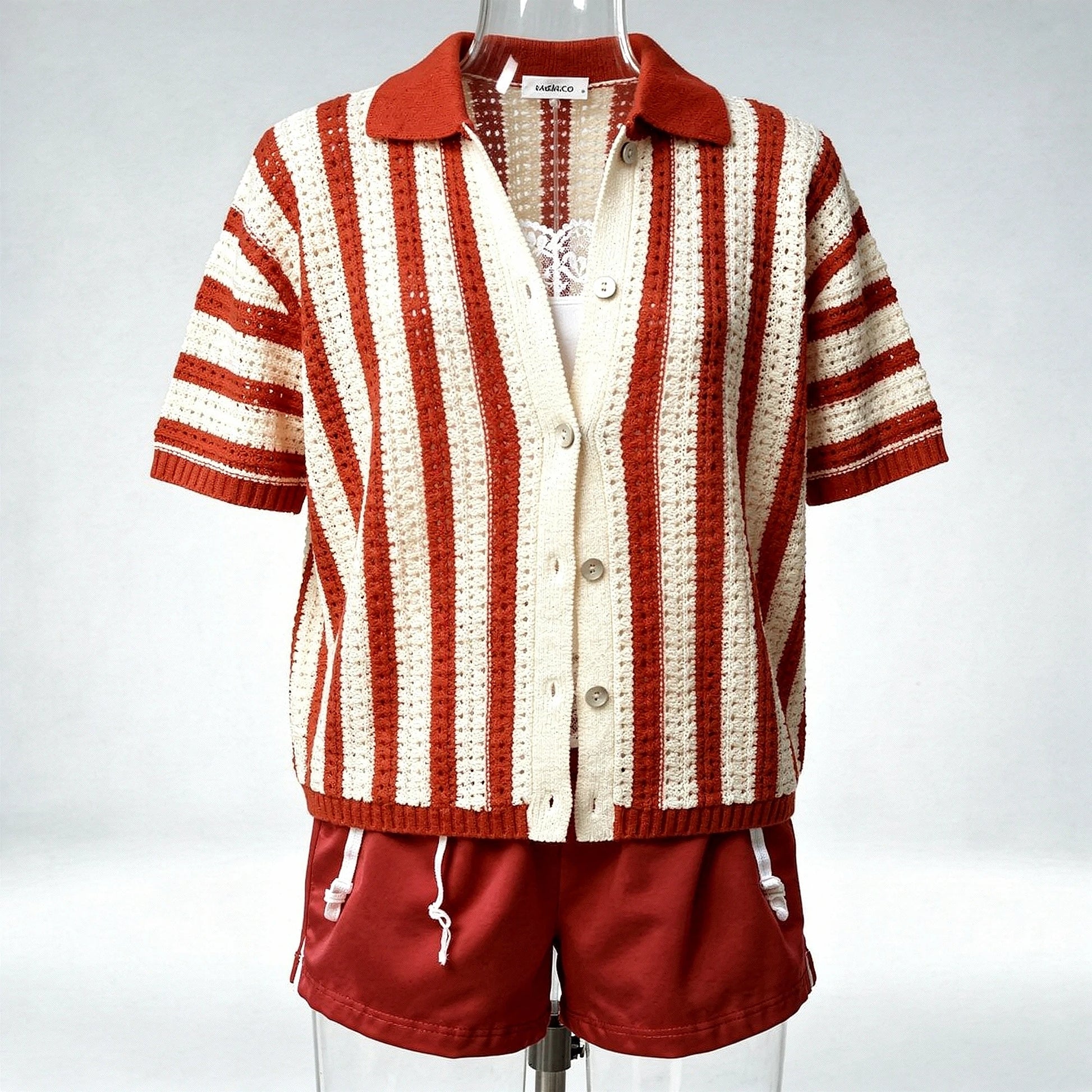 Light gray cardigan featuring a soft knit texture, open design, and long sleeves, detailed view