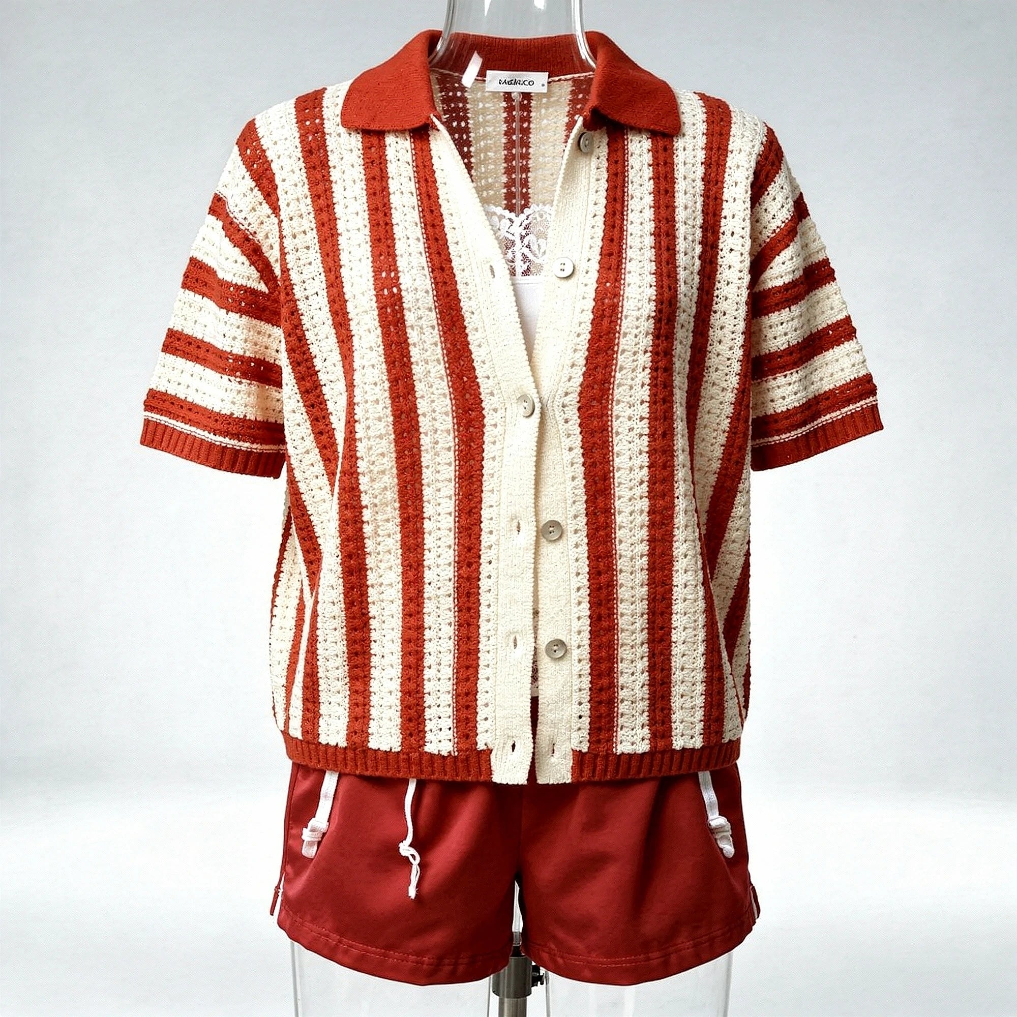 Light gray cardigan featuring a soft knit texture, open design, and long sleeves, detailed view