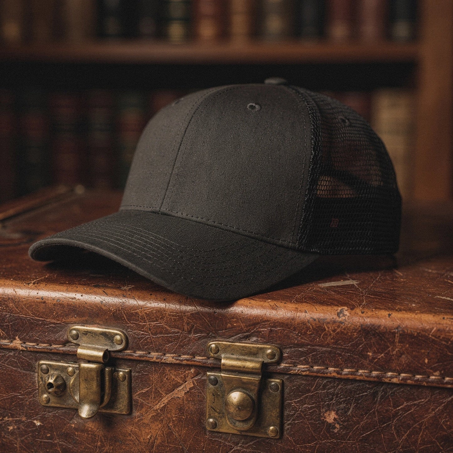 View of a relaxed vintage snapback cap in dark gray fabric, featuring a curved brim and adjustable strap