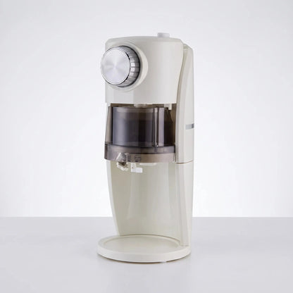 View of the compact ice shaver revealing the power cord, ventilation slits, and a sturdy base design