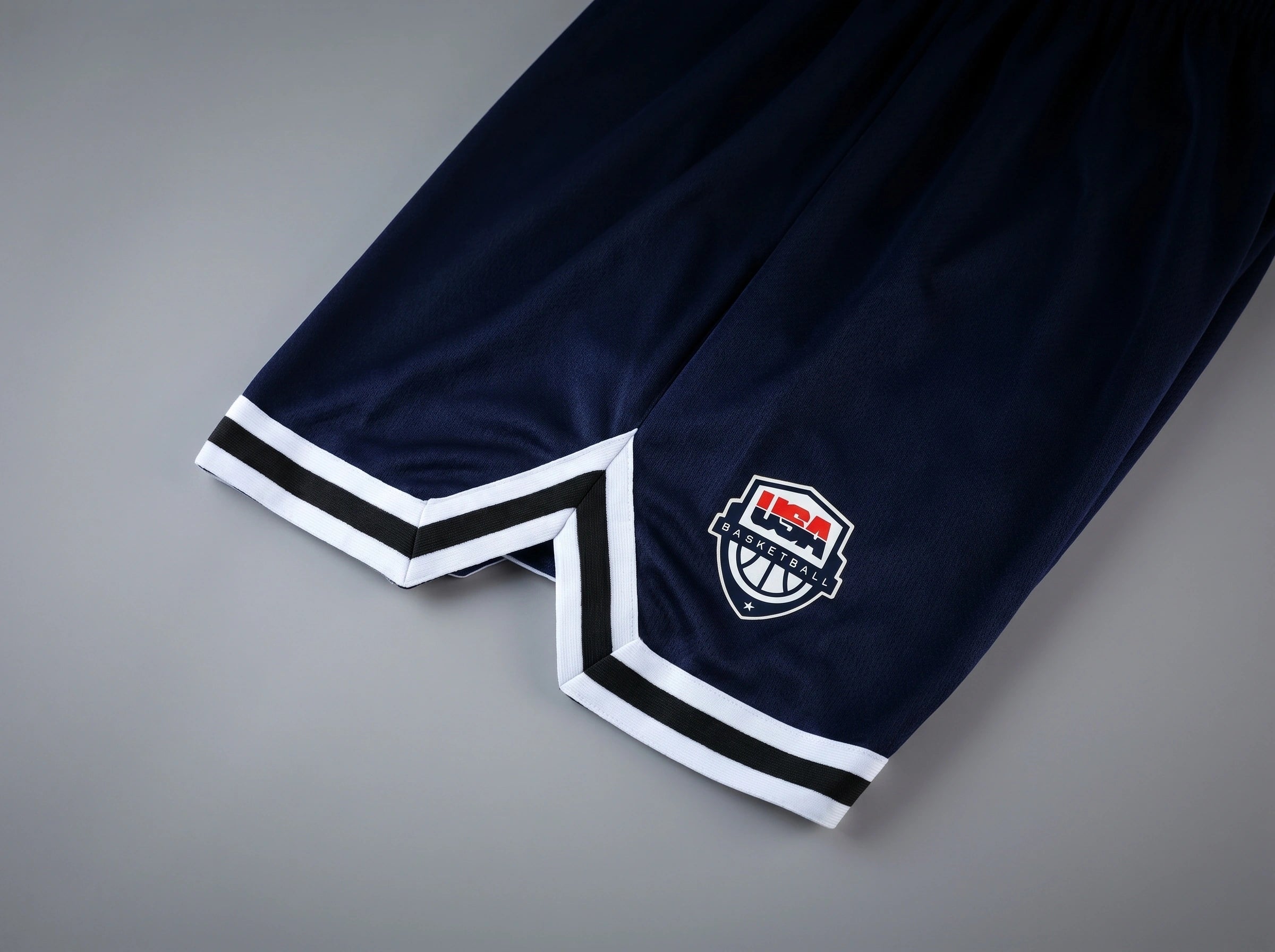 Close up view of the breathable fabric and precise stitching of men's athletic lightweight summer shorts, showing their quality and design for active lifestyles.