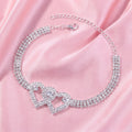 A model showcases the Womens Sparkling Anklet, paired with a high waisted skirt and a blouse against a soft, neutral background.