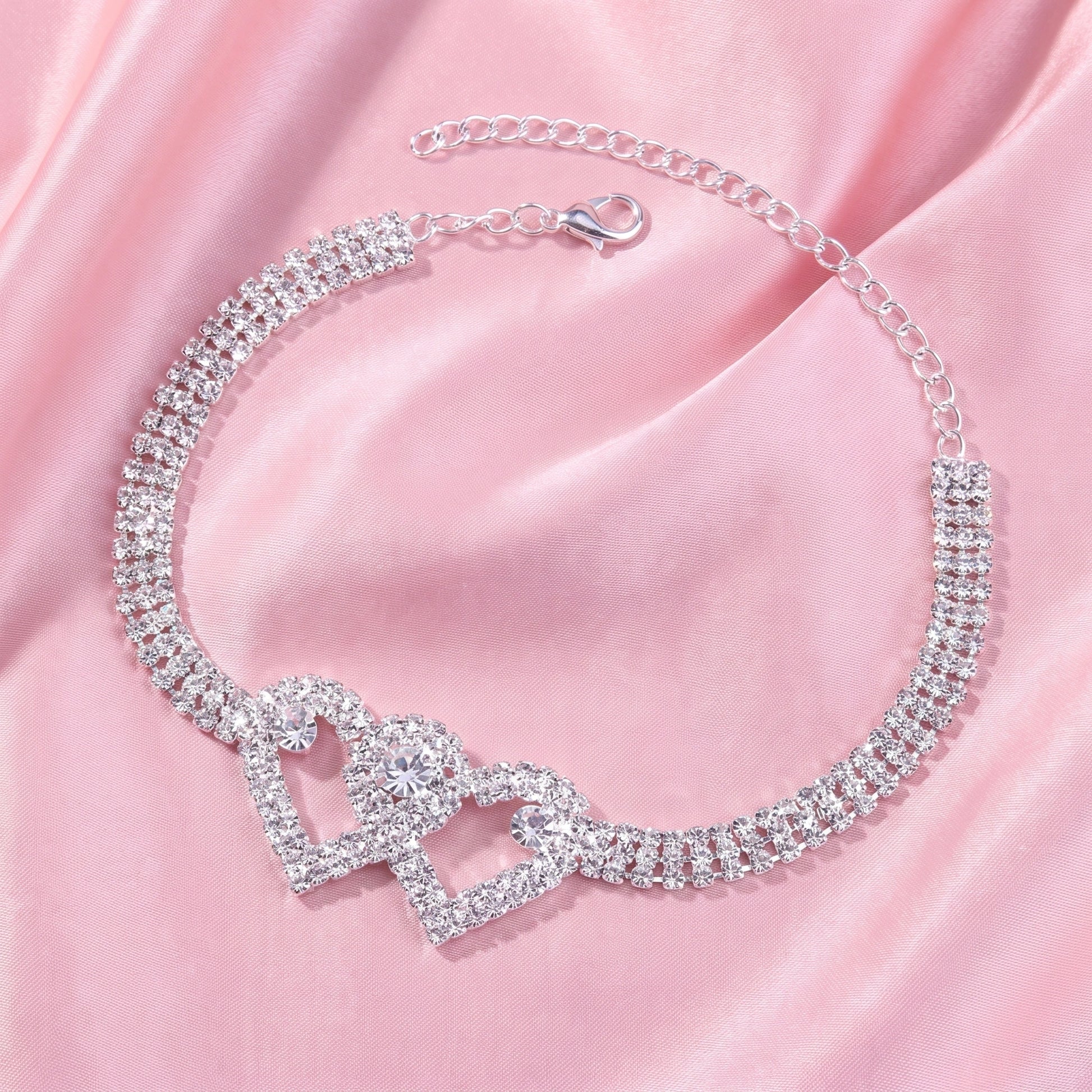 A model showcases the Womens Sparkling Anklet, paired with a high waisted skirt and a blouse against a soft, neutral background.