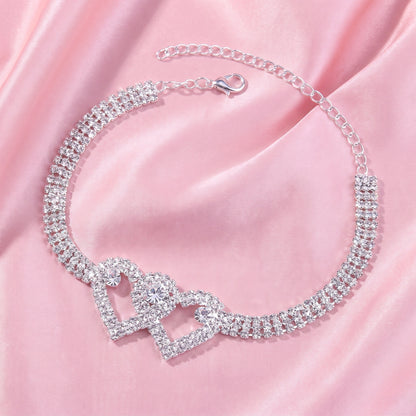 A model showcases the Womens Sparkling Anklet, paired with a high waisted skirt and a blouse against a soft, neutral background.