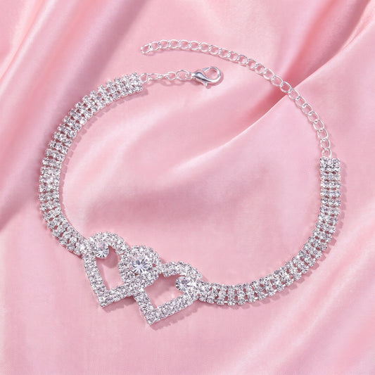 A model showcases the Womens Sparkling Anklet, paired with a high waisted skirt and a blouse against a soft, neutral background.