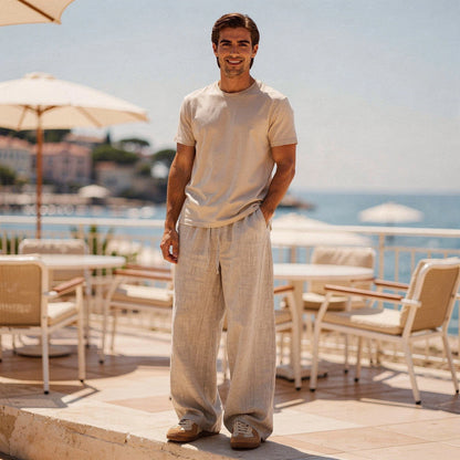 Lightweight summer trousers in light beige, featuring a relaxed fit, pockets, and a comfortable waistband, view
