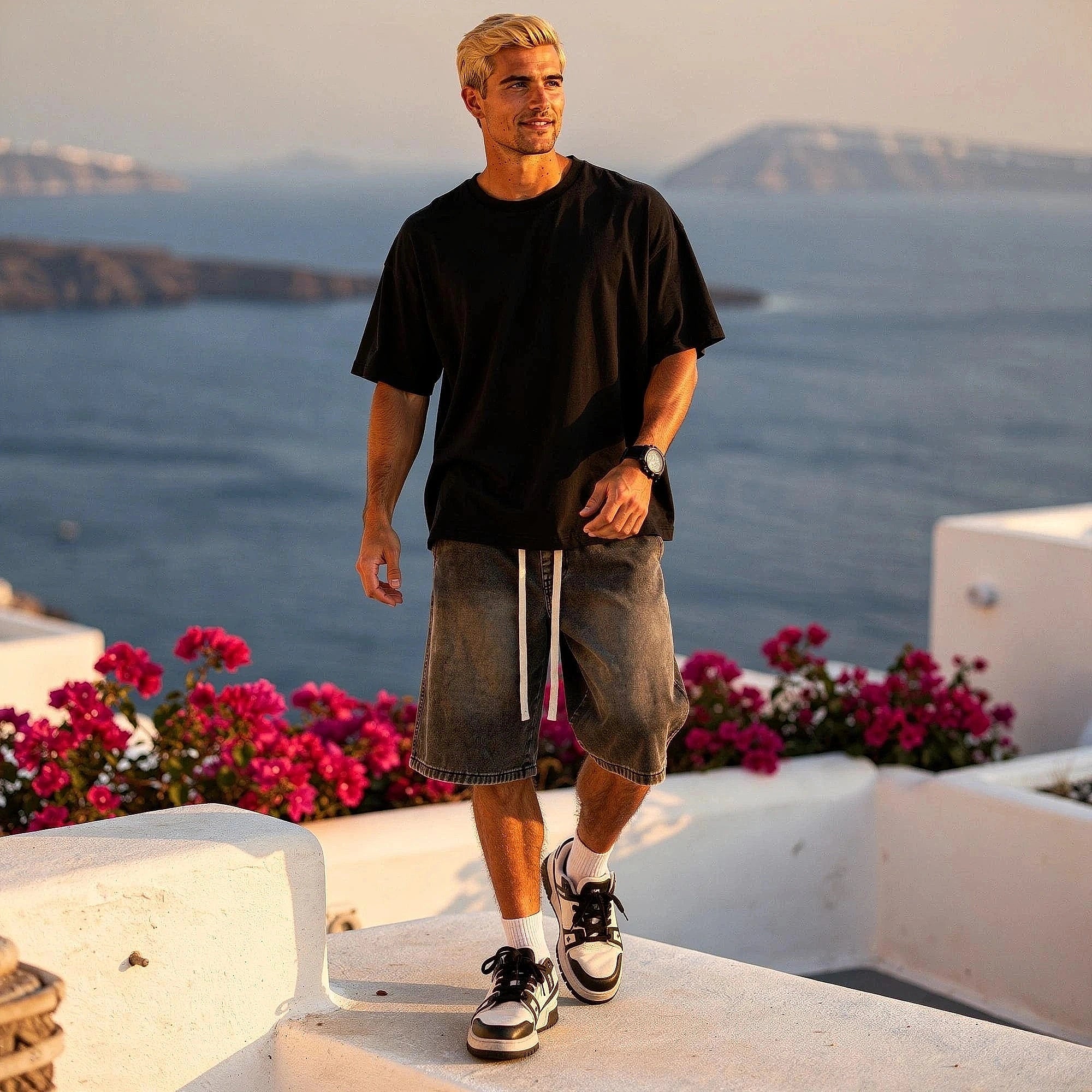 View of relaxed fit denim shorts in light blue, featuring an elastic waistband and classic five pocket design