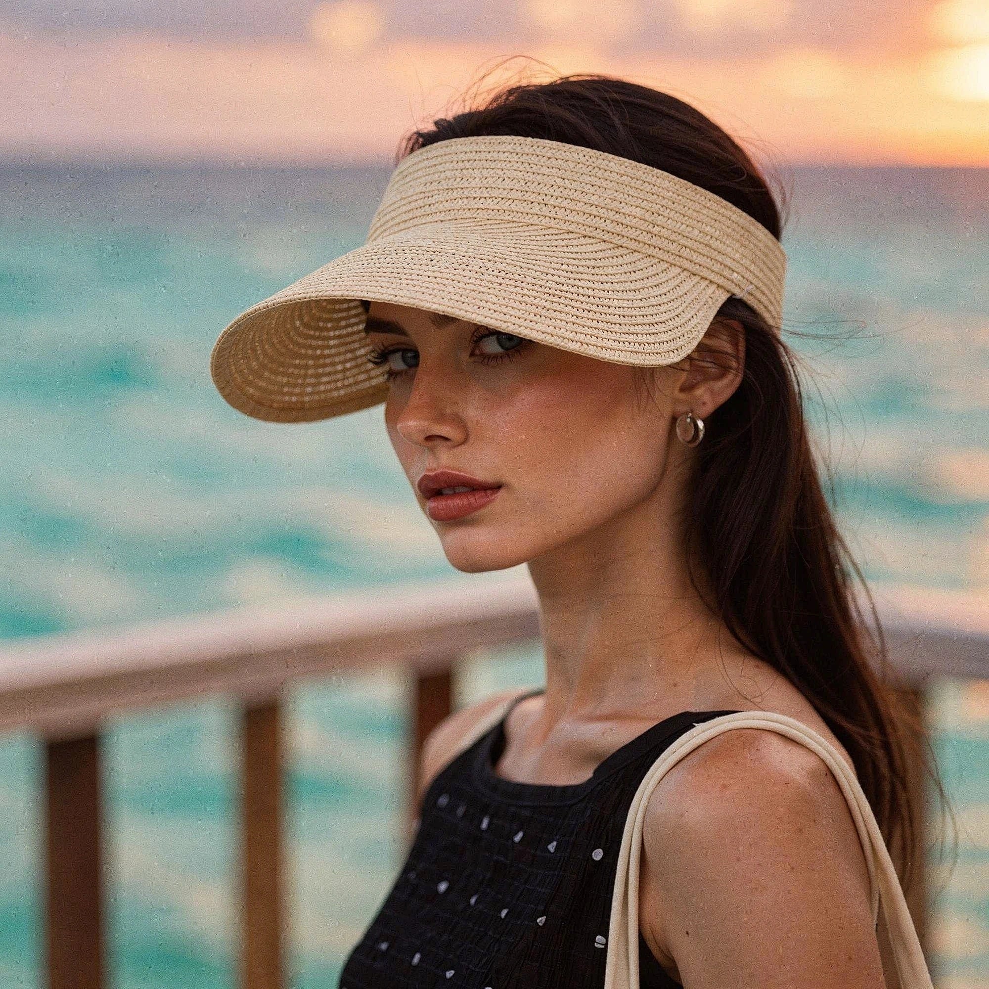 View of a chic summer visor hat in light beige, featuring a wide brim and breathable woven material