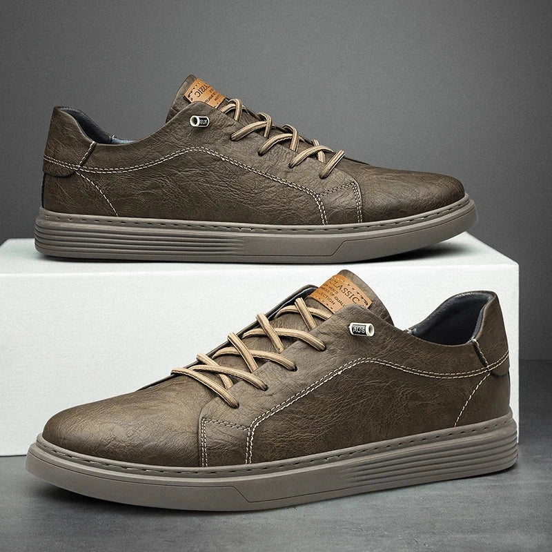 View of brown lace up shoes made of soft leather, featuring a textured surface and round toe design