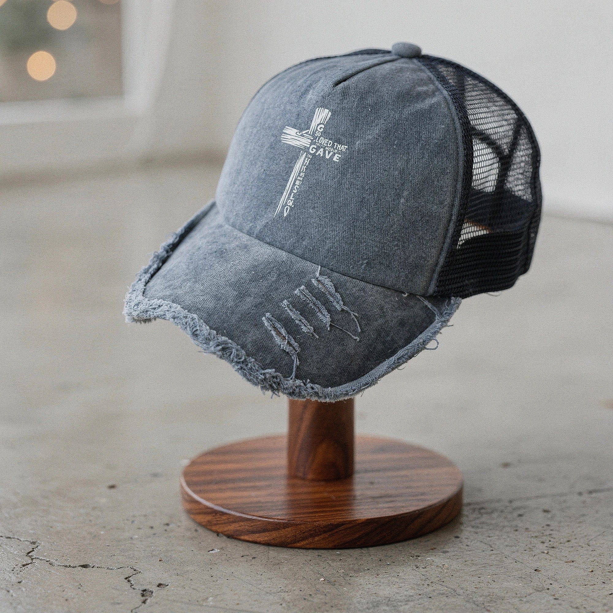 Light pink women's baseball cap made of breathable fabric, featuring a curved brim and adjustable strap, detailed view