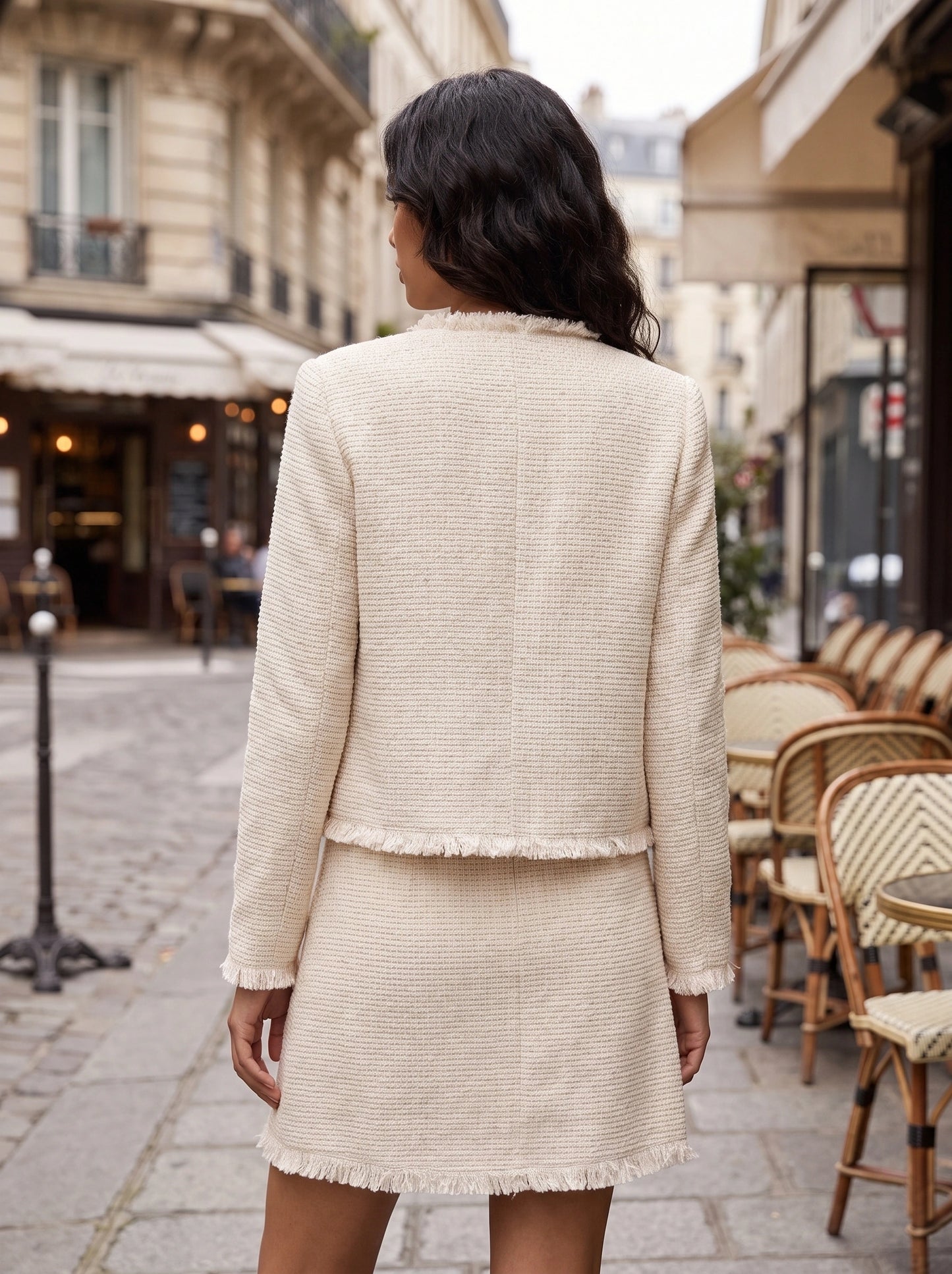 Back view of a model showing the Womens Textured Autumn Jacket in a warm hue, showing its sophisticated construction and tailored fit against a neutral background.