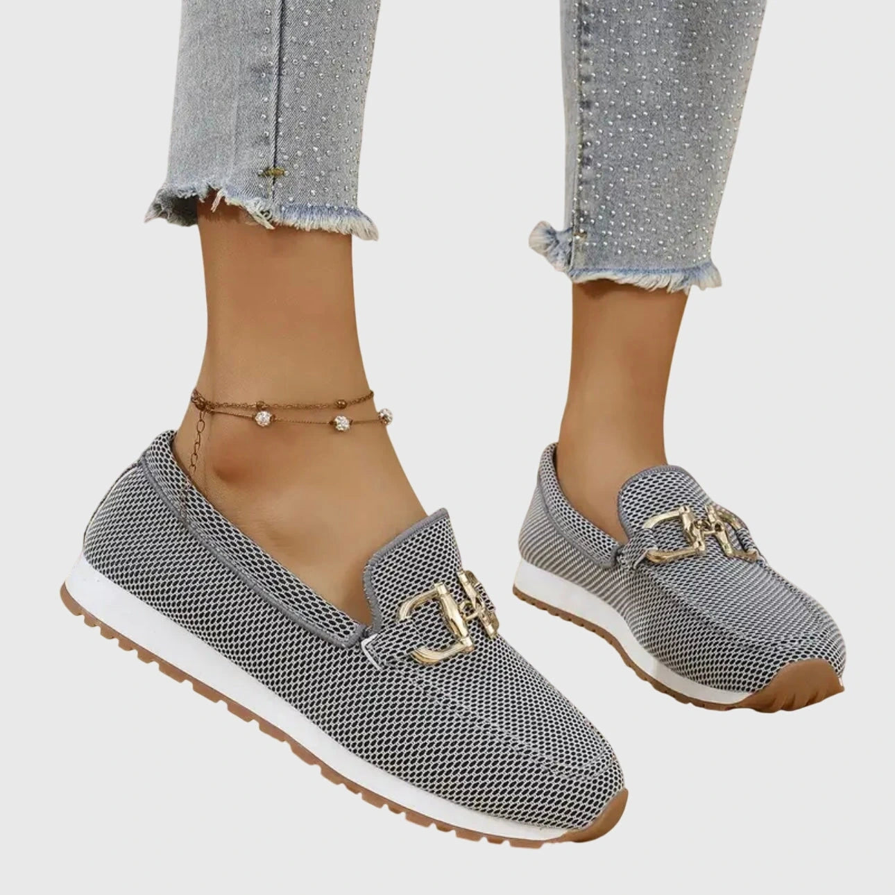 View of elegant women's loafers in soft beige leather, featuring a breathable design and subtle stitching accents
