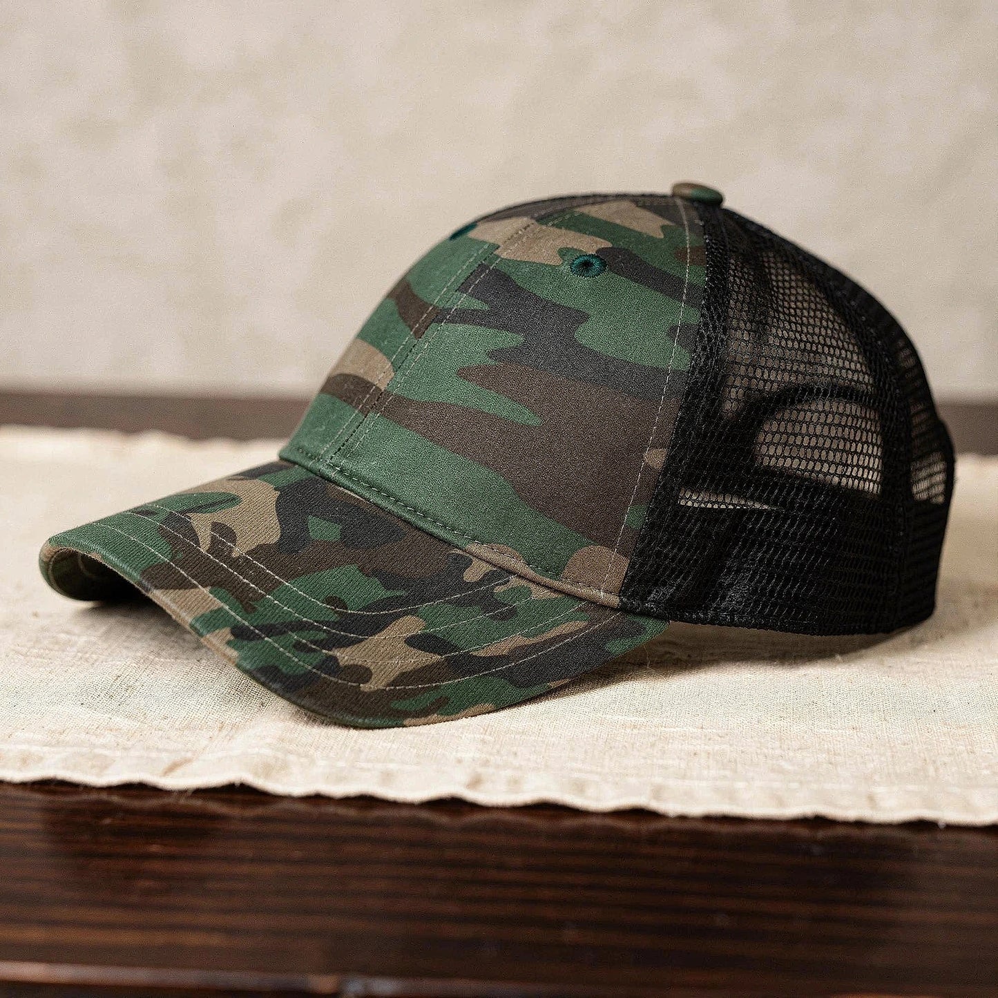 View of a relaxed vintage snapback cap in dark green, featuring a textured fabric and adjustable strap