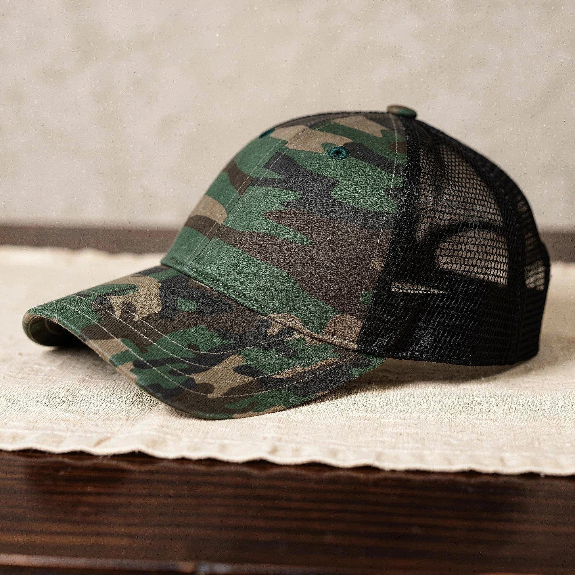 View of a relaxed vintage snapback cap in dark green, featuring a textured fabric and adjustable strap