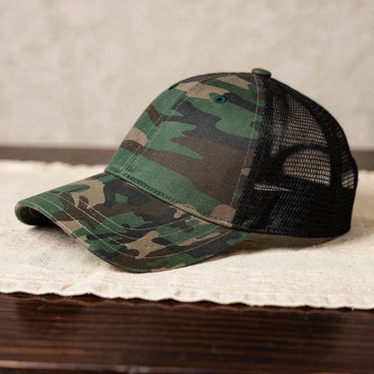 View of a relaxed vintage snapback cap in dark green, featuring a textured fabric and adjustable strap