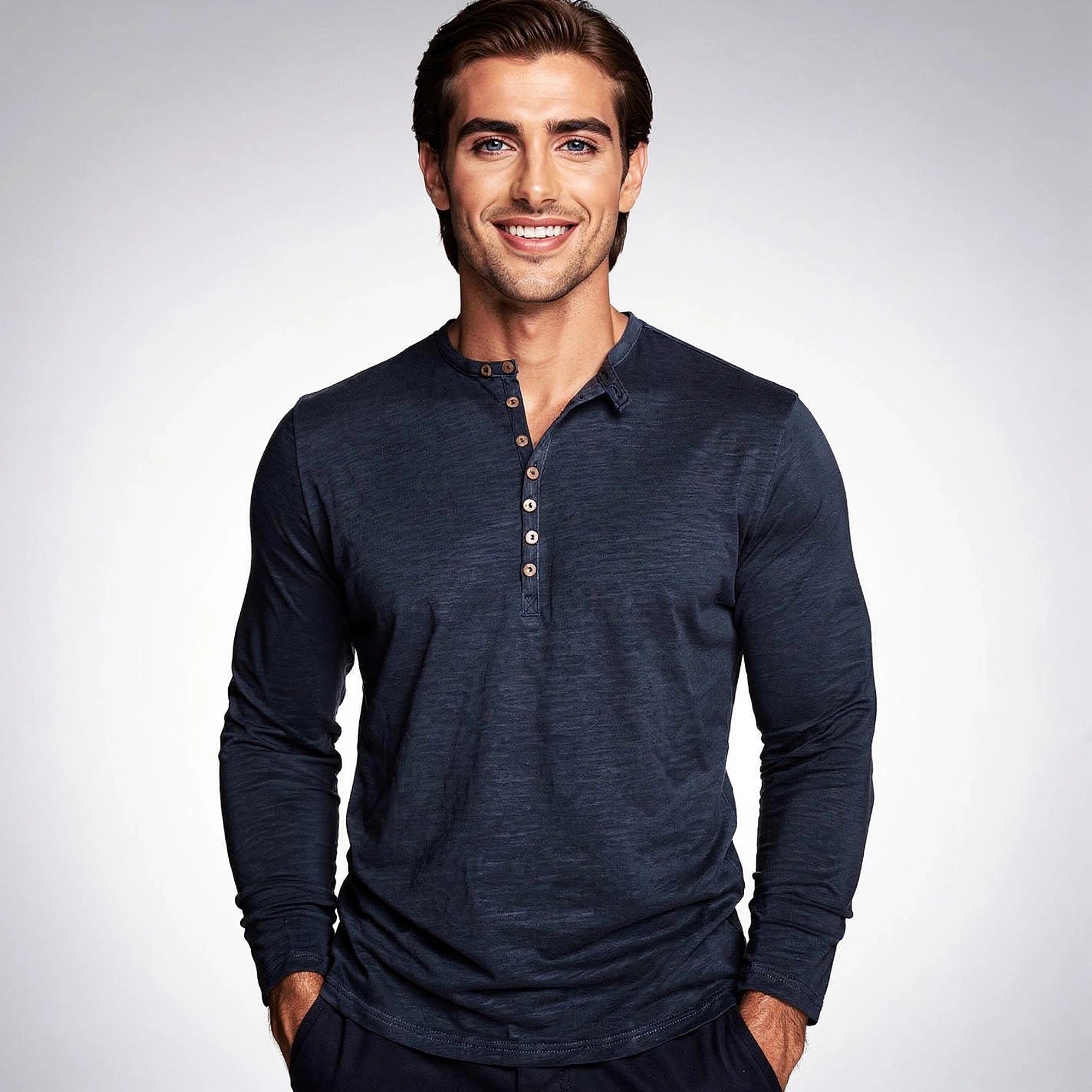 View of a light gray long sleeve henley shirt made from soft cotton, featuring three buttons at the neckline