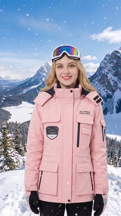 A model showcases the women's warm windproof waterproof ski jacket in a colorful, styled with outdoor accessories against a snowy mountain backdrop.
