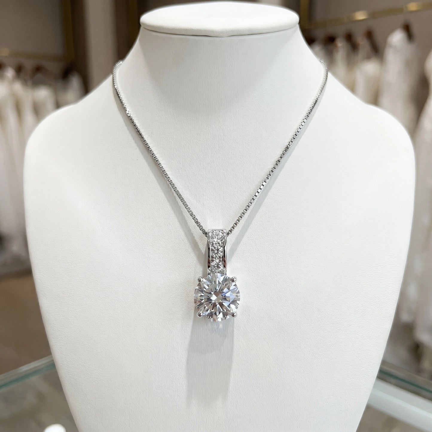 Back view of a model showing the Womens Timeless Bridal Jewelry Set, showing intricate details and craftsmanship against a soft, neutral background.