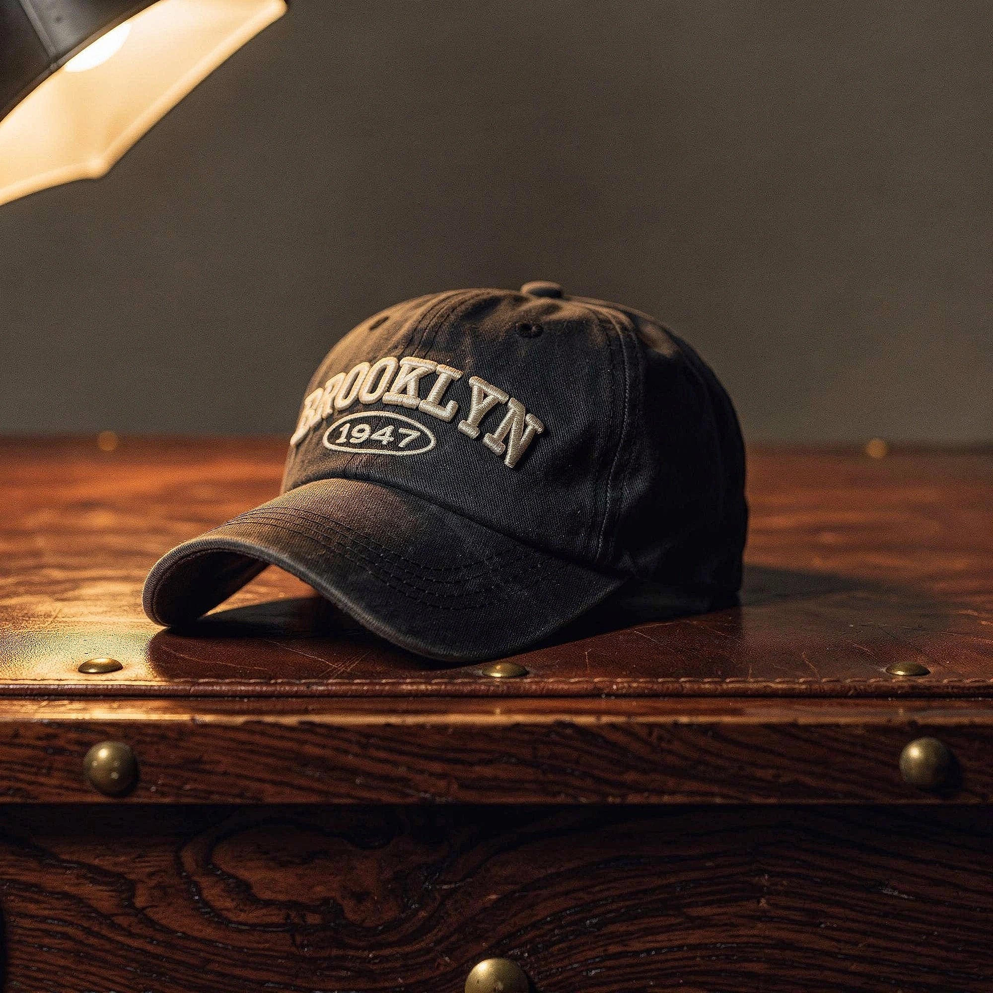 View of a navy blue embroidered cap featuring a casual chic design with a comfortable fit and adjustable strap