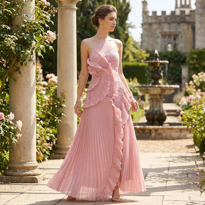 Close up view of the Womens Pleated Maxi Dress showing the intricate pleating and stitching in a soft pastel color against a neutral background.