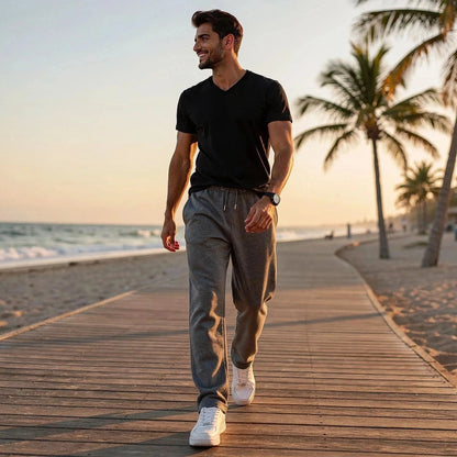 Light beige relaxed casual pants with a comfortable fit, featuring a view that showcases the waistband and pockets