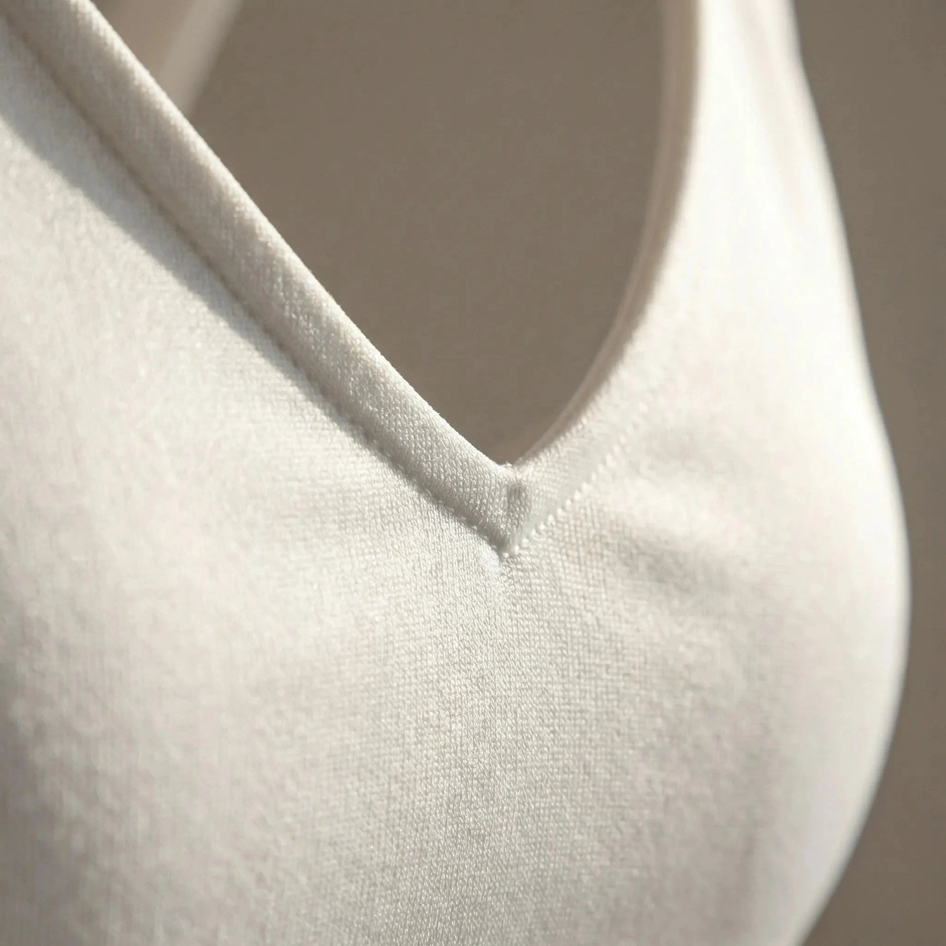 View of a chic supportive cropped top in soft fabric, featuring a stylish design and comfortable fit