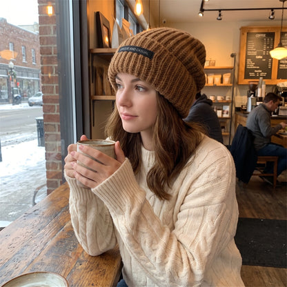 Close up view of the soft, textured fabric and intricate stitching of the Womens Cozy Slouchy Winter Beanie in a neutral color.