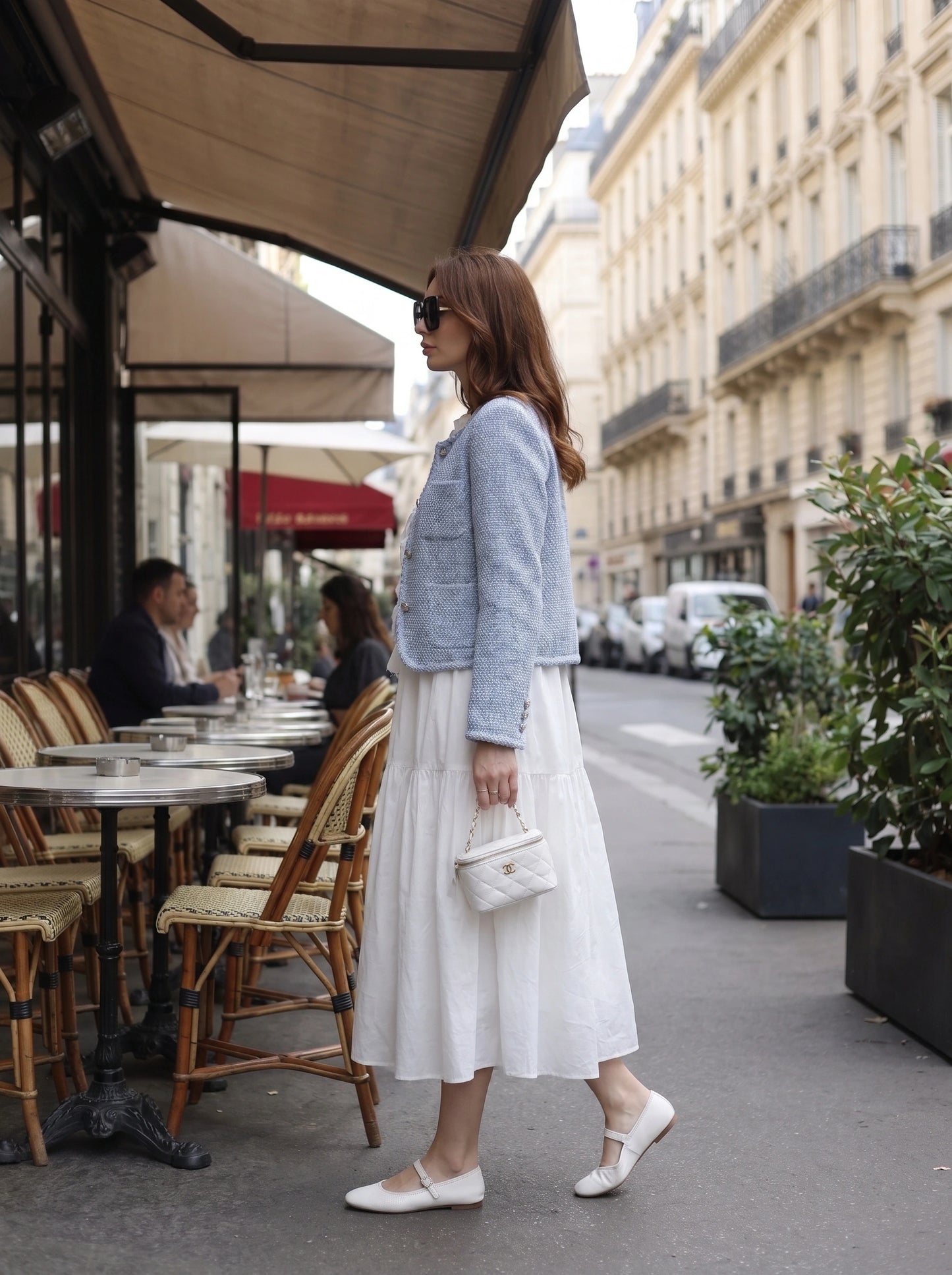 A model showcases the Womens Structured Autumn Jacket in a rich burgundy color, styled with high waisted trousers against a neutral background.