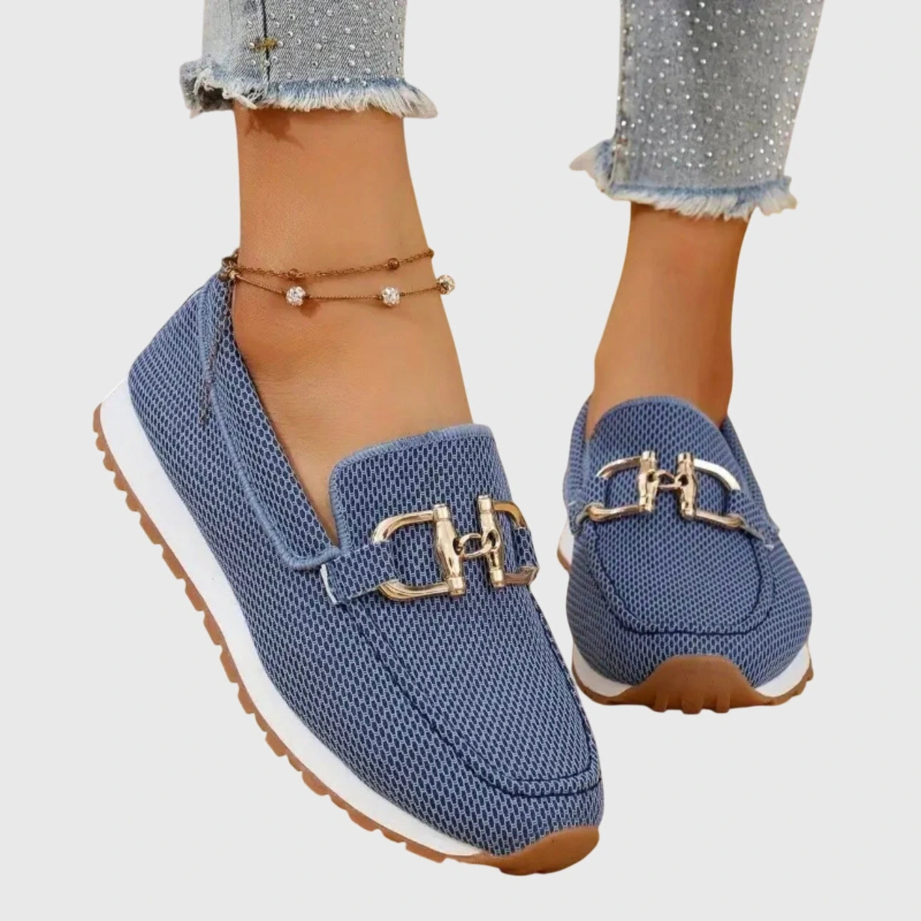 View of elegant women's loafers in soft beige, featuring breathable material and a sleek, casual design