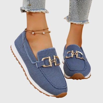 View of elegant women's loafers in soft beige, featuring breathable material and a sleek, casual design