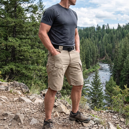 Close up of the men's functional practical cargo shorts showing durable fabric, precise stitching, and practical pockets against a neutral background.