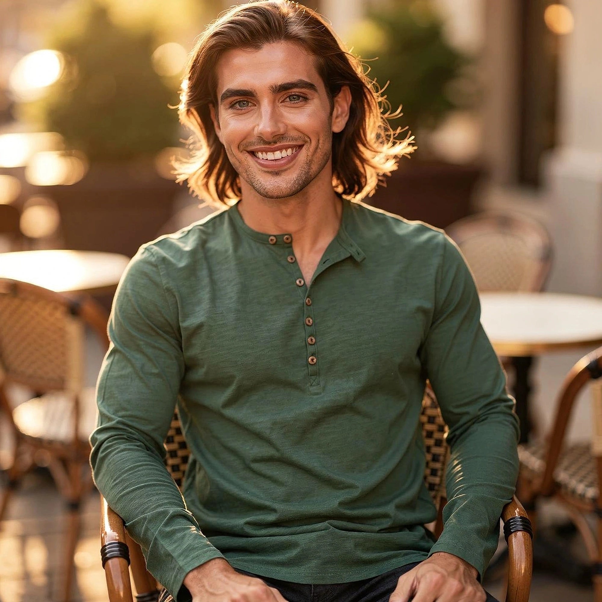 View of a light gray long sleeve henley shirt made of soft cotton, featuring a button placket and ribbed cuffs
