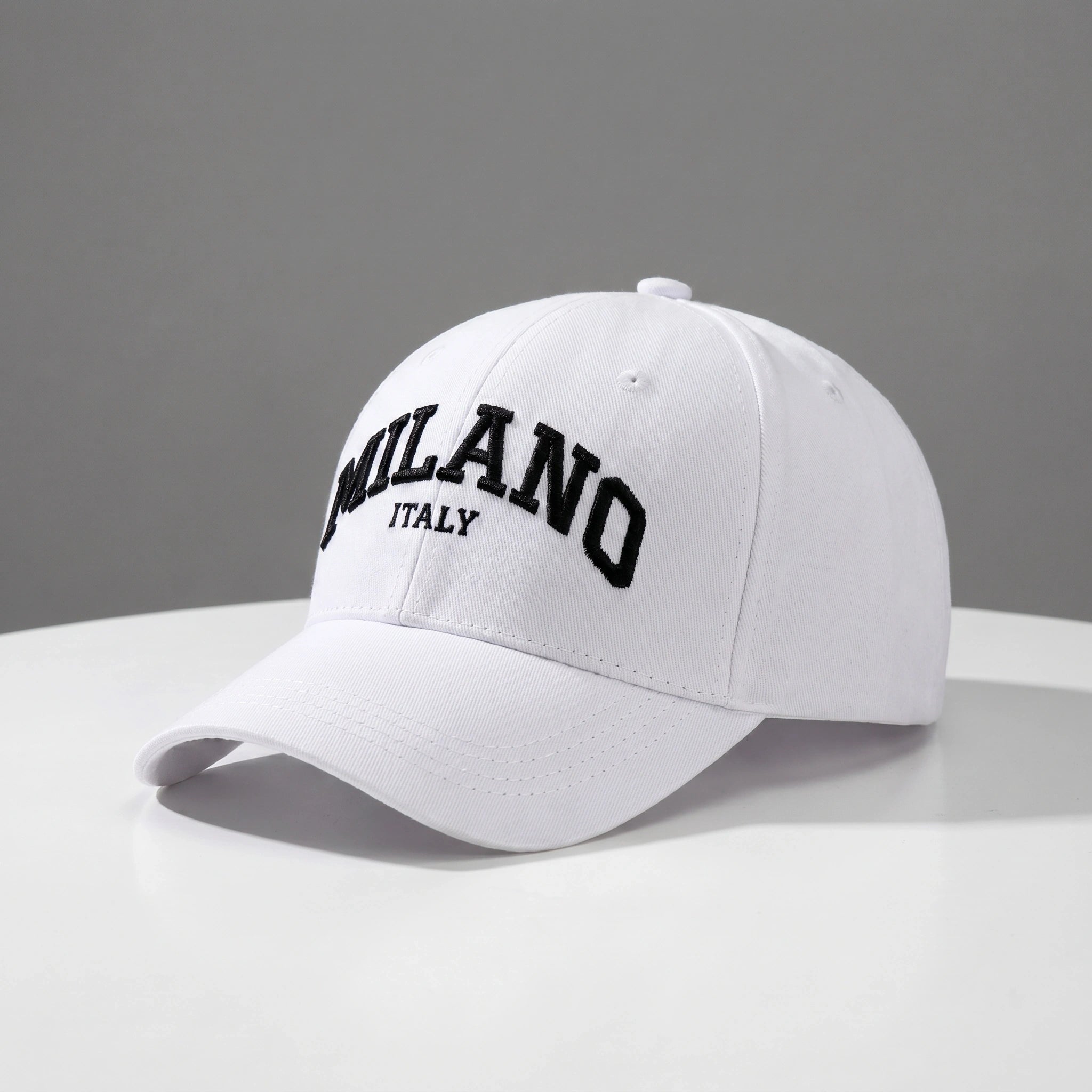 Close up view of the embroidered design and durable fabric of the adjustable baseball cap, showing its quality craftsmanship against a neutral background.