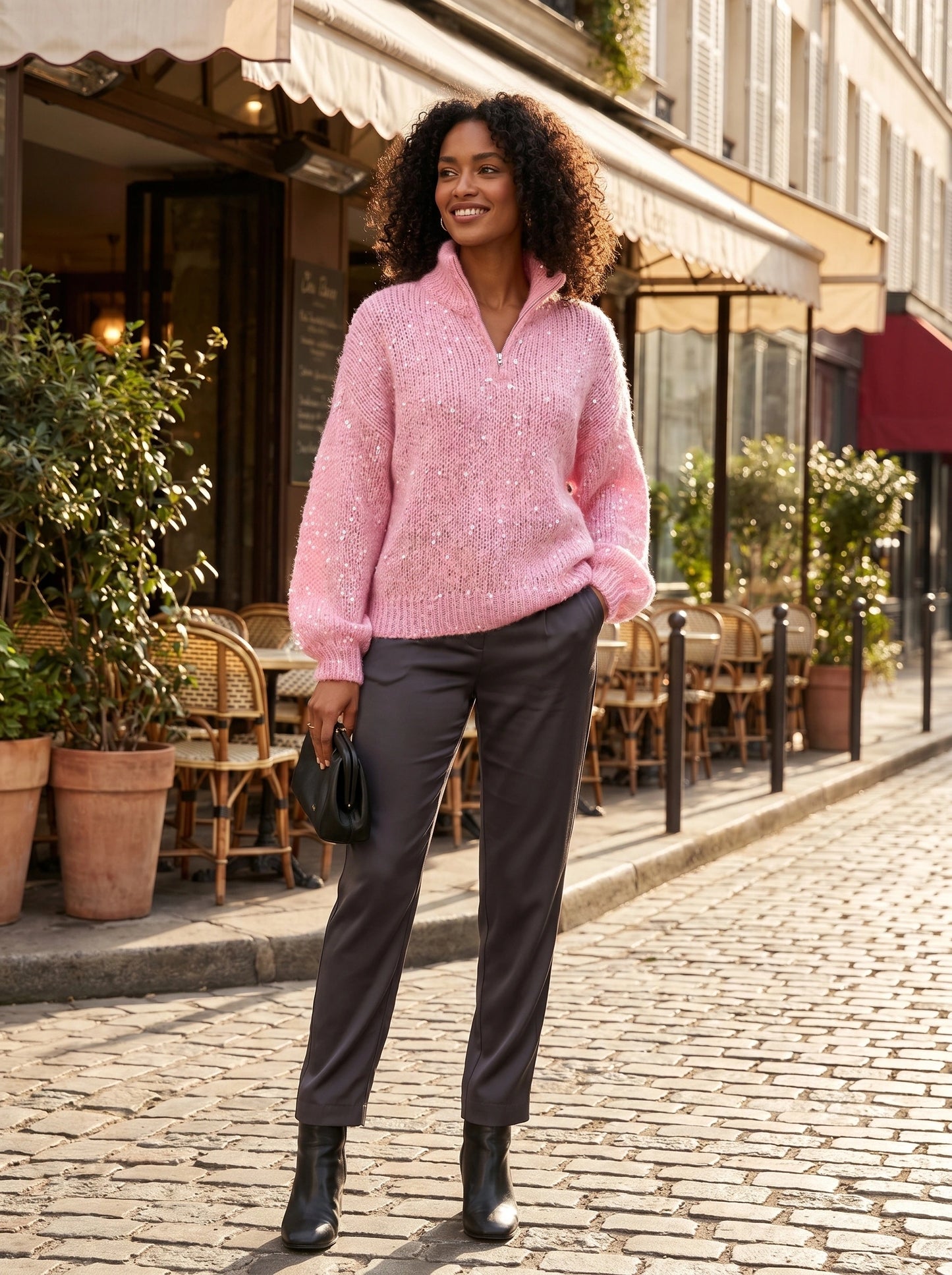 Close up view of the Womens Shiny Sweater showing its luxurious fabric and intricate stitching details against a neutral background.