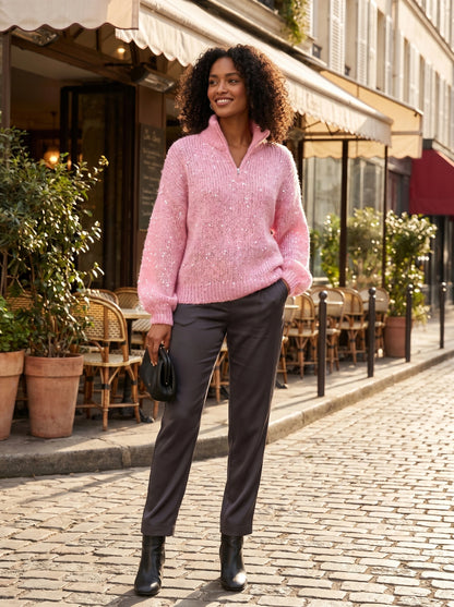 Close up view of the Womens Shiny Sweater showing its luxurious fabric and intricate stitching details against a neutral background.