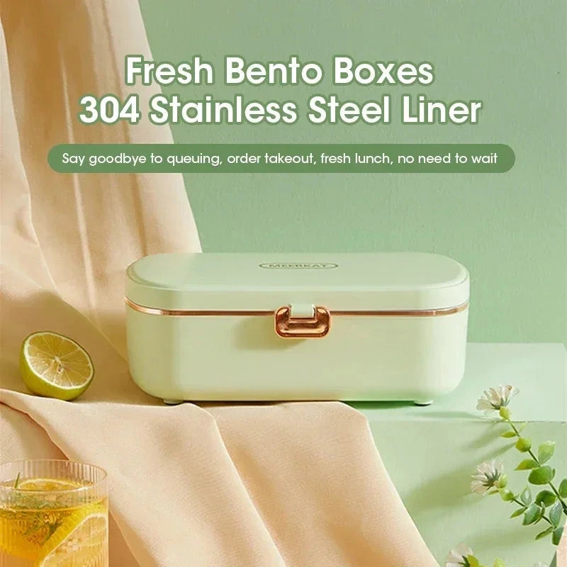 View of a compact insulated electric lunch box in sleek gray, featuring a removable inner container and convenient carrying handle