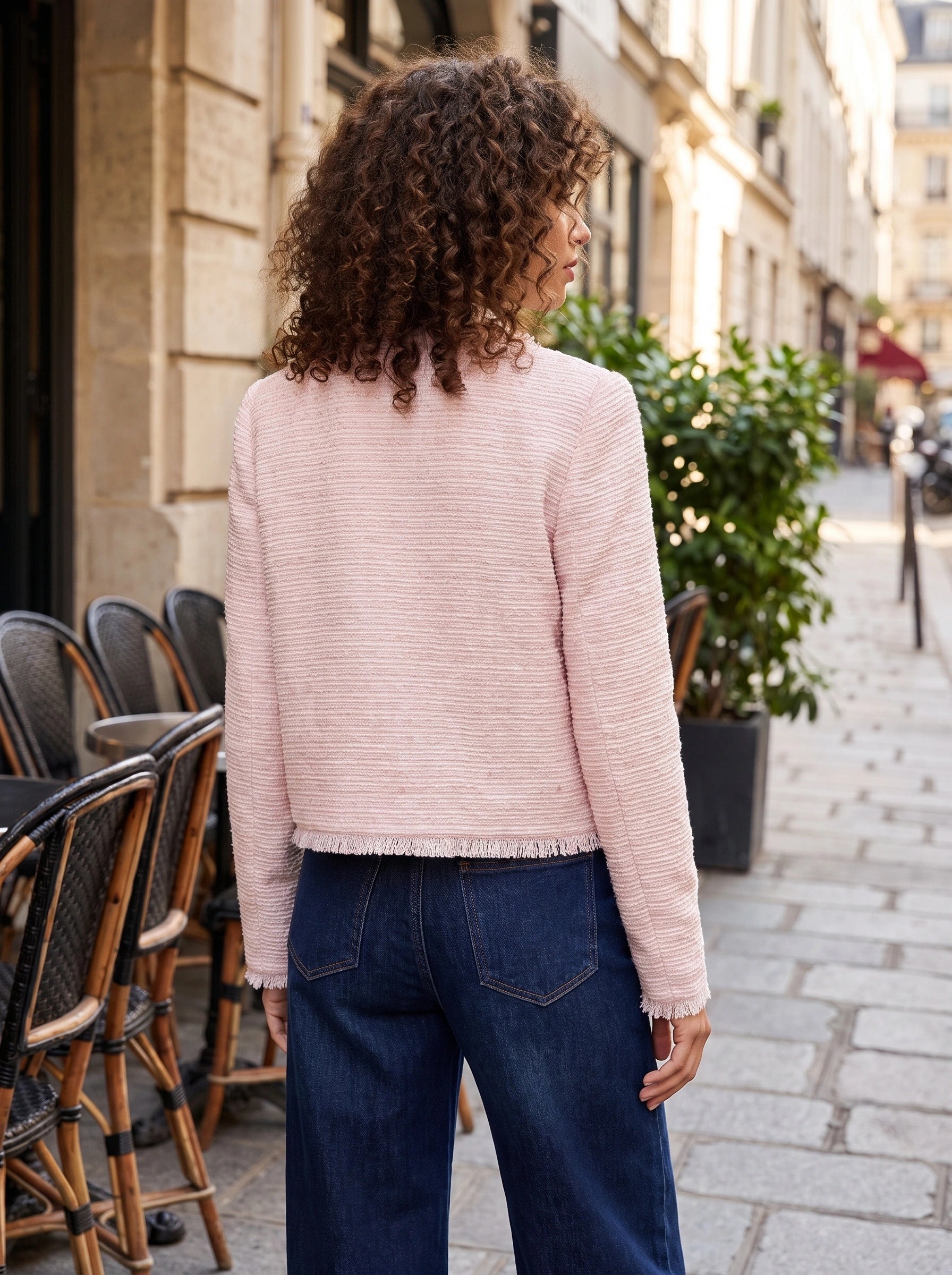 Close up view of the women's textured spring crop jacket showing intricate stitching and fabric , perfect for adding sophistication to any outfit.