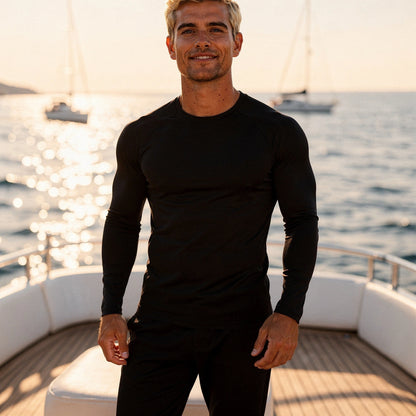 View of a black fleece backed winter tee featuring a snug fit and moisture wicking fabric, highlighting the texture and stitching