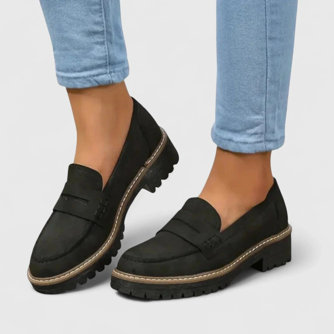 Elegant black loafers made of soft leather, featuring a classic design and comfortable orthopaedic support, view