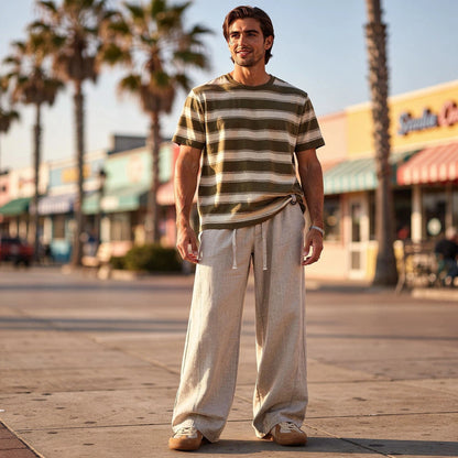 Lightweight summer trousers in light gray, featuring a relaxed fit, drawstring waist, and pockets, detailed view