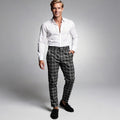 View of modern tailored tapered trousers in charcoal gray fabric, featuring a sleek design and tailored fit