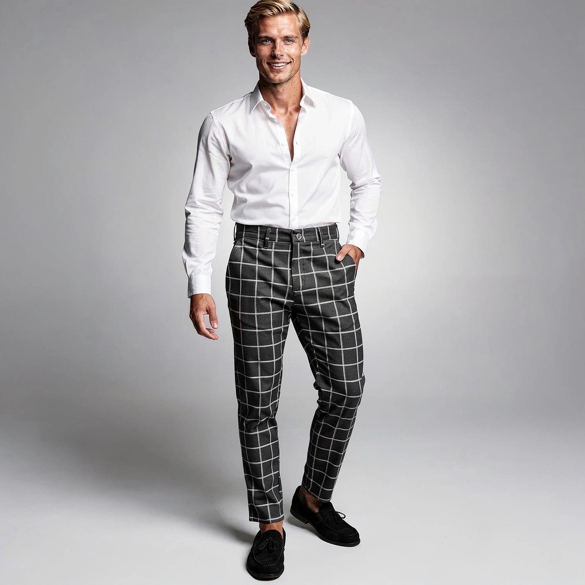 View of modern tailored tapered trousers in charcoal gray fabric, featuring a sleek design and tailored fit