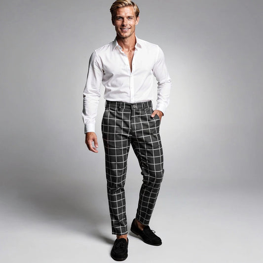View of modern tailored tapered trousers in charcoal gray fabric, featuring a sleek design and tailored fit